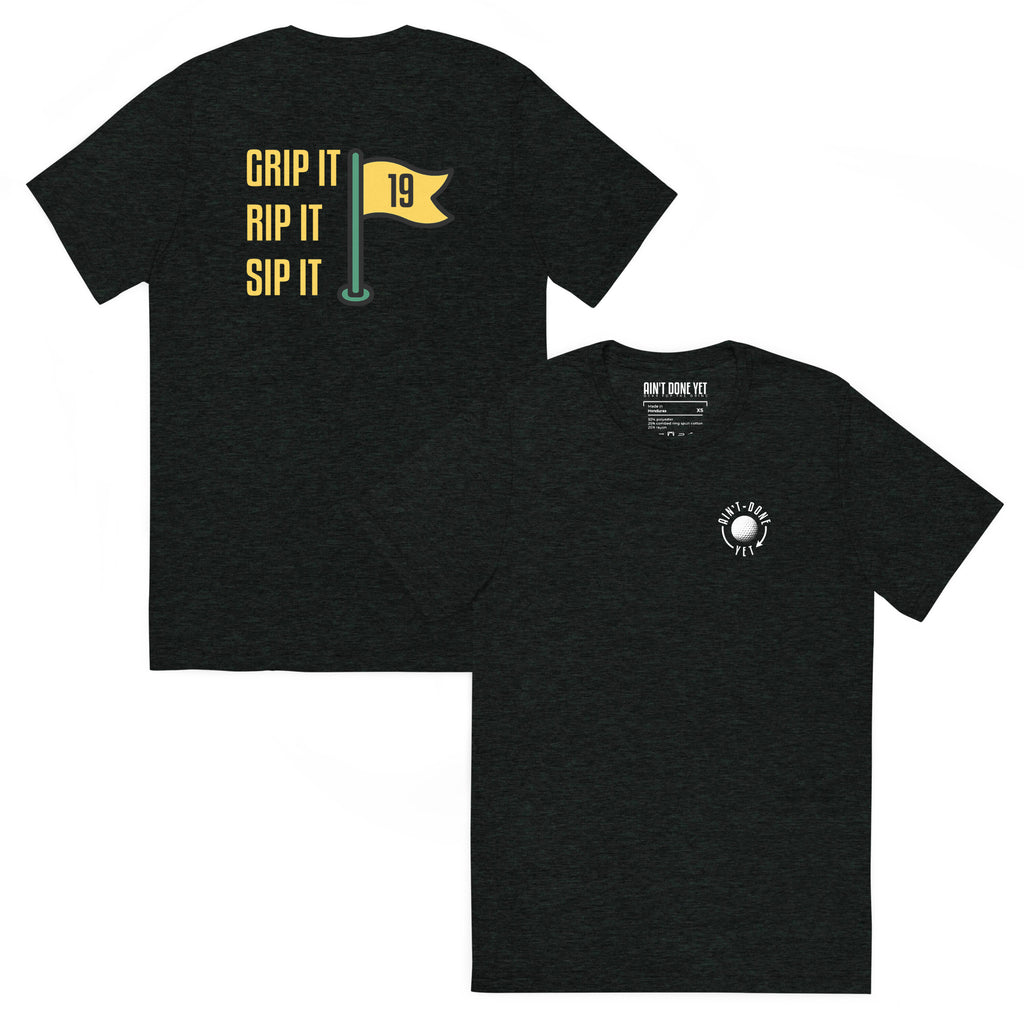 19th Hole Tee with Ain’t Done Yet golf logo on chest and Grip It Rip It Sip It flag graphic on back
