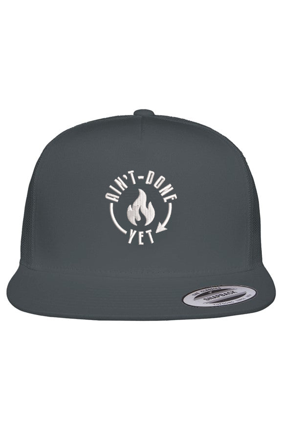 Dark grey Big Head Energy Cap with oversized high-profile crown, flat bill and embroidered white Ain't Done Yet flame logo