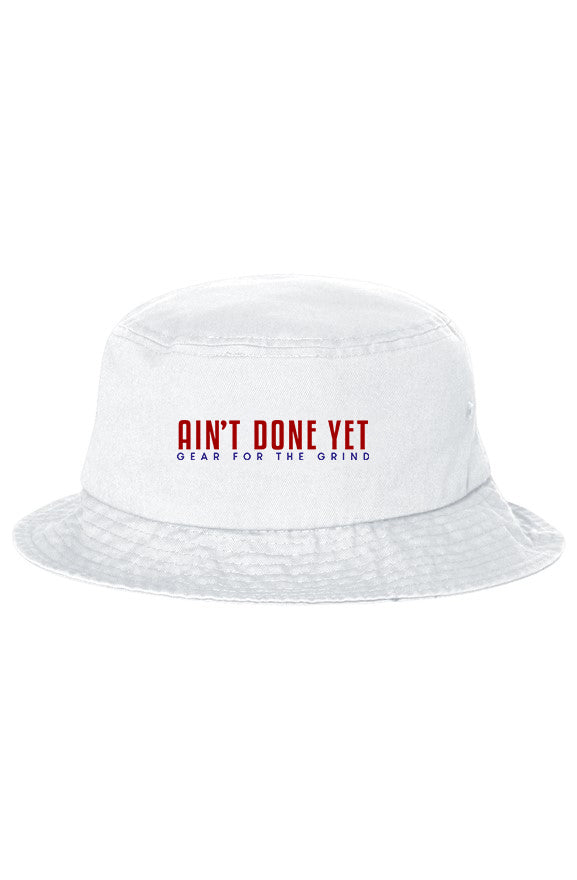White OG Bucket hat with red and blue Ain't Done Yet Gear for the Grind logo, full brim and sewn ventilation eyelets