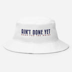 The Freedom Bucket hat in white featuring embroidered Ain't Done Yet logo and Gear For The Grind tagline in patriotic colors.