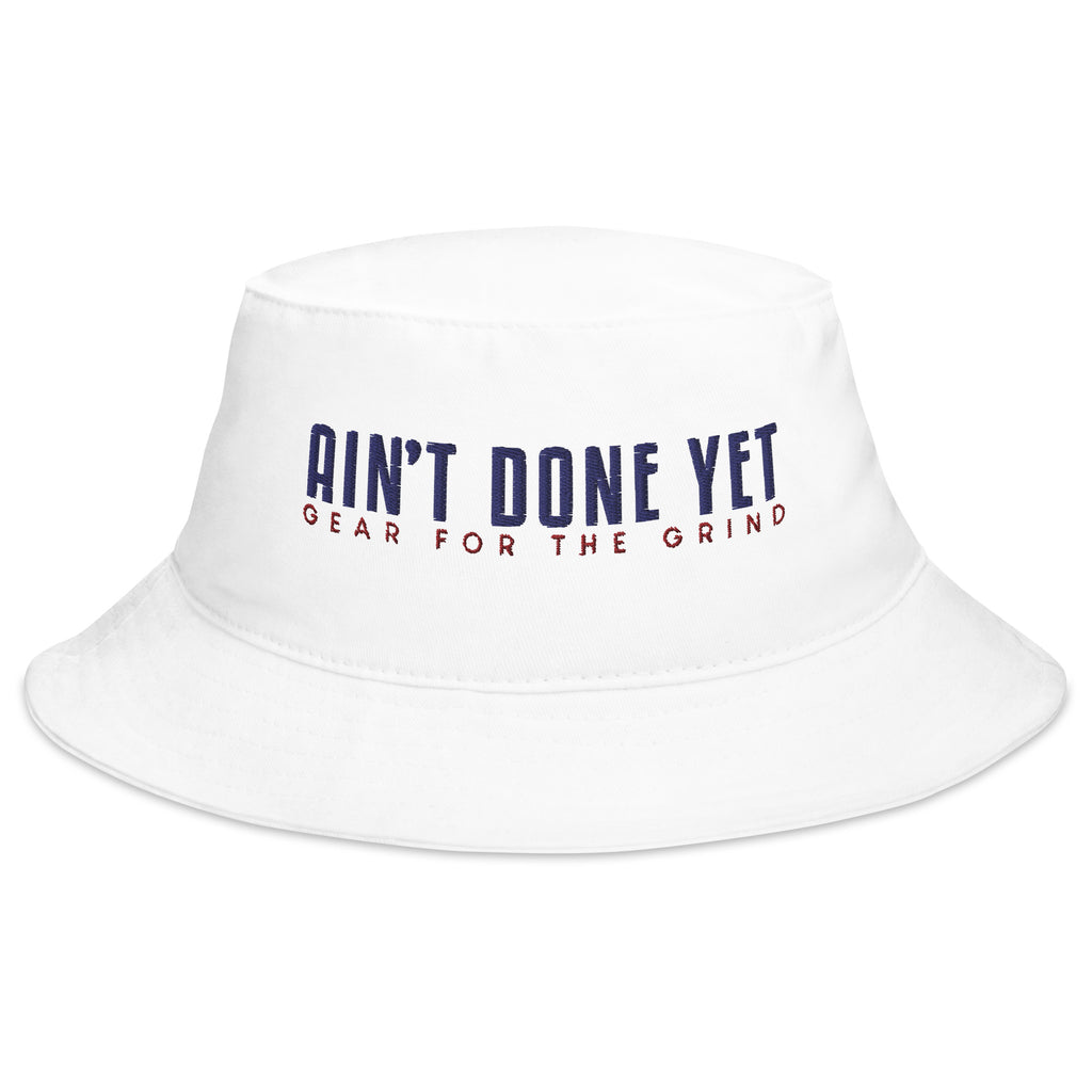 The Freedom Bucket hat in white featuring embroidered Ain't Done Yet logo and Gear For The Grind tagline in patriotic colors.