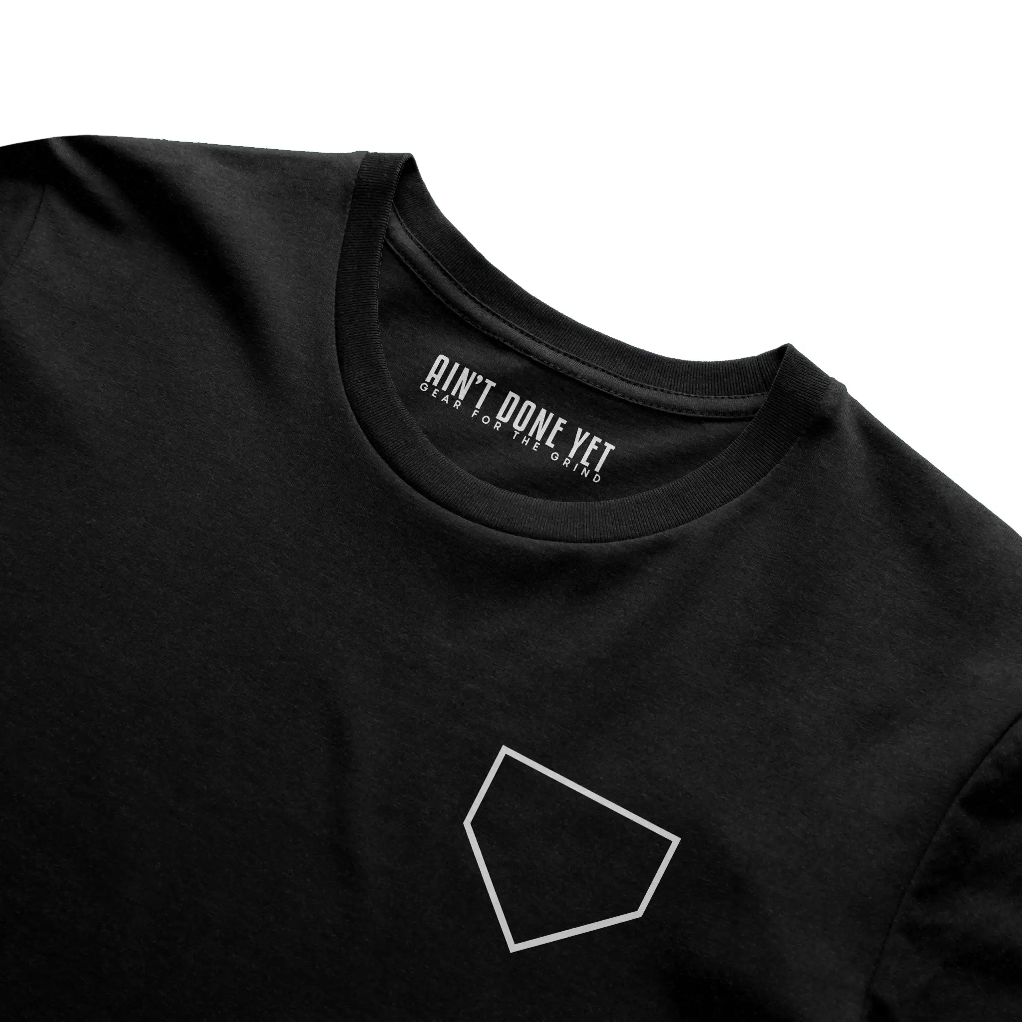 Middle Middle Tee with home plate graphic on front and baseball seam design with Ain’t Done Yet branding on back
