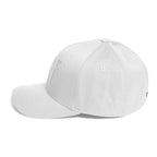 Flex-fit golf hat featuring Play Code GLF front embroidery with structured six-panel design and silver undervisor
