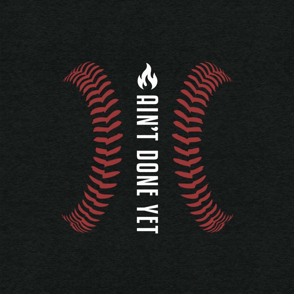 Ain’t Done Yet Middle Middle baseball tee featuring home plate graphic and baseball seam design on a lightweight tri-blend shirt.