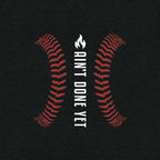 Ain’t Done Yet Middle Middle baseball tee featuring home plate graphic and baseball seam design on a lightweight tri-blend shirt.