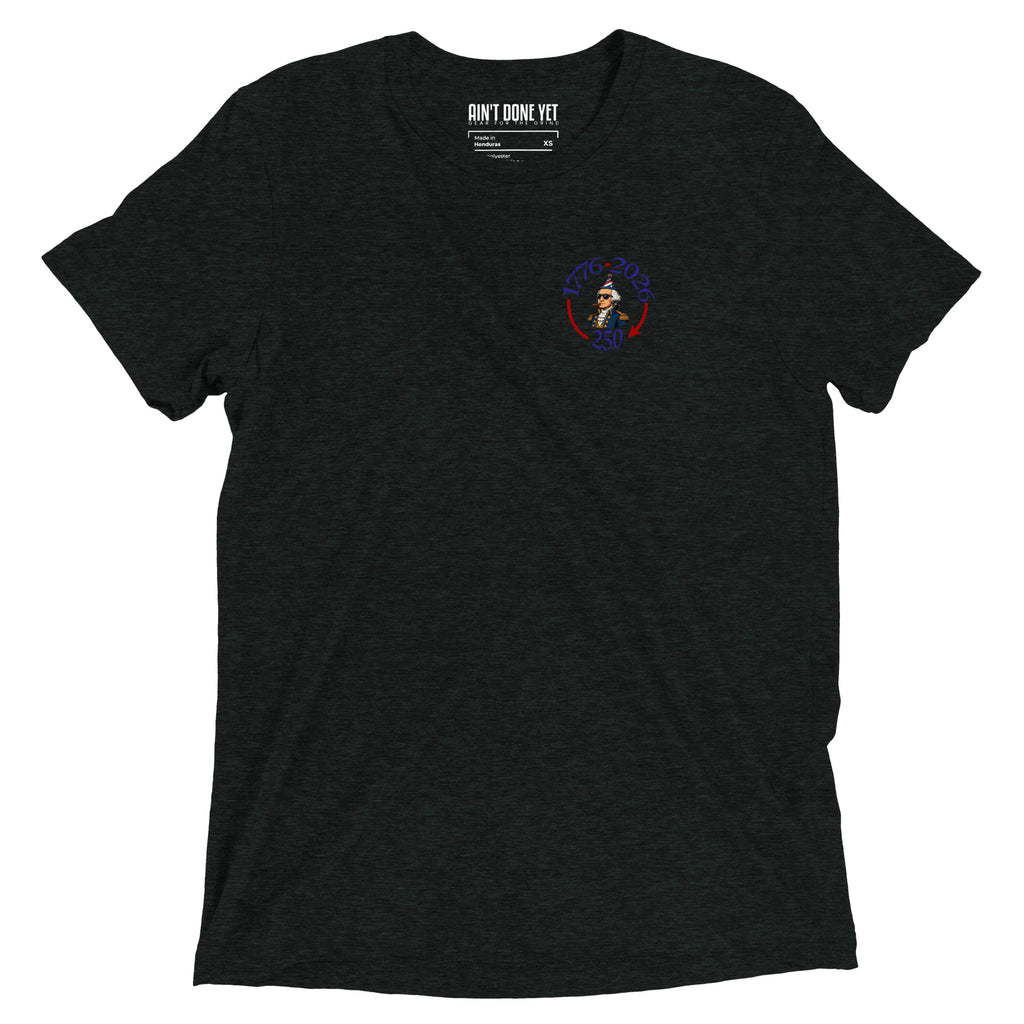 Still Partying America 250 charcoal t-shirt featuring George Washington wearing a birthday hat and sunglasses with a cigar, commemorating America's 250th anniversary.