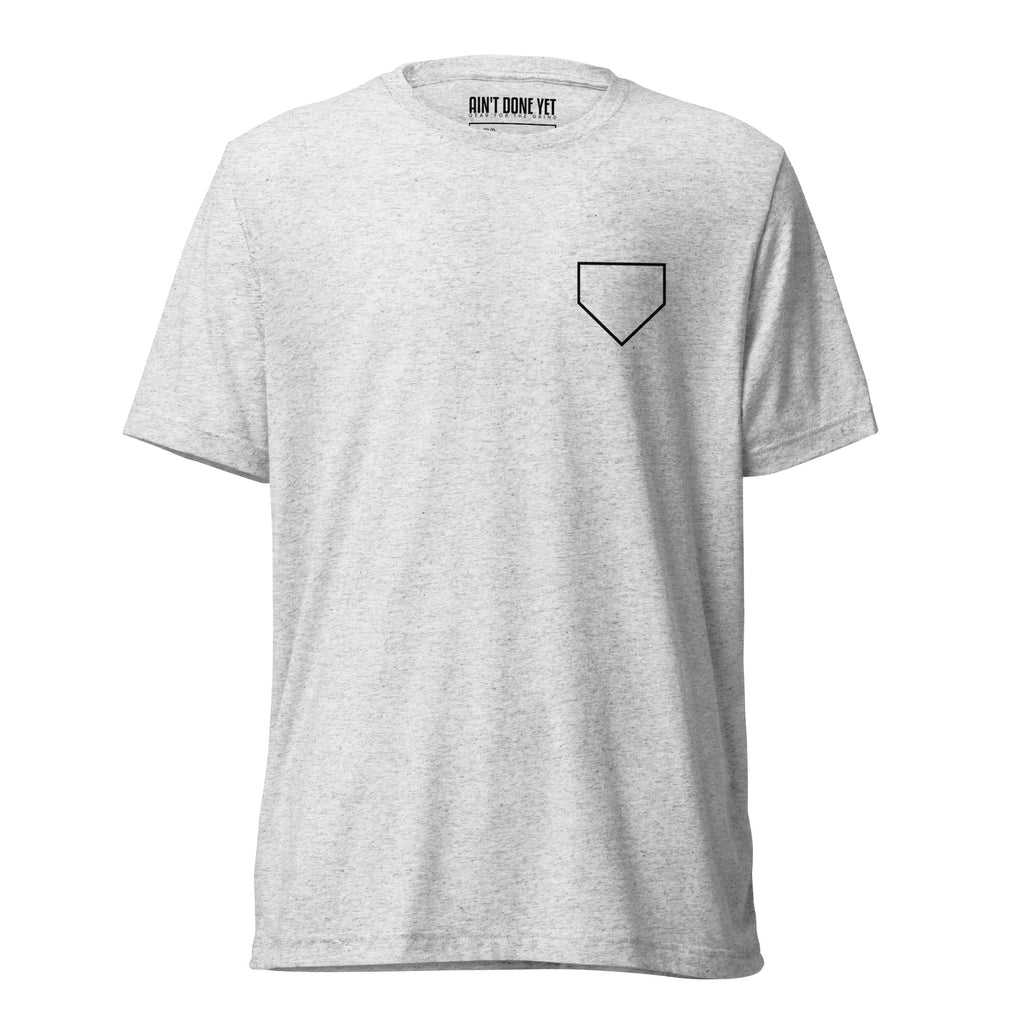 Ain’t Done Yet Middle Middle baseball tee featuring home plate graphic and baseball seam design on a lightweight tri-blend shirt.